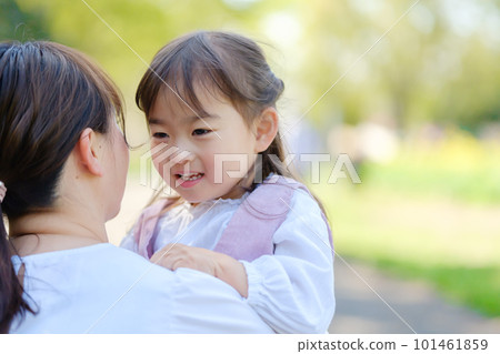 A mother hugging a girl 101461859
