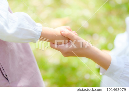 mother holding girl's hand mother holding girl's hand 101462079