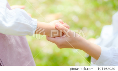 mother holding girl's hand mother holding girl's hand 101462080