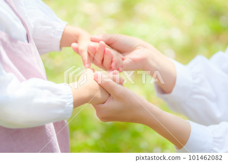 mother holding girl's hand mother holding girl's hand 101462082