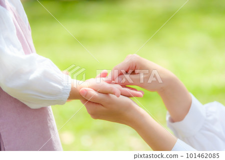 mother holding girl's hand mother holding girl's hand 101462085