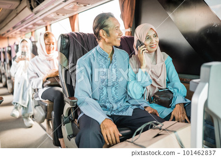 couple travel by bus during eid mubarak holiday to meet family at home 101462837