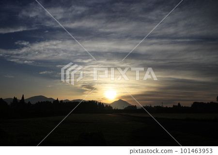 Beautiful silhouette of Mt. Takachiho illuminated by the morning sun 101463953