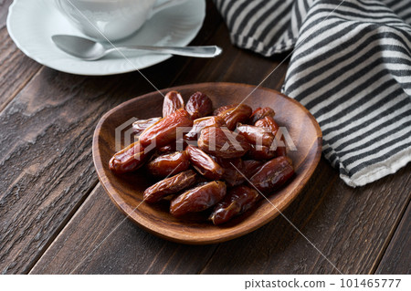 Seeded dried dates on a plate 101465777