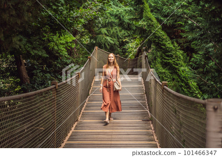Woman tourist in Rope bridge in Yildiz Park. Besiktas, Istanbul, Turkey. Turkiye Woman tourist in Rope bridge in Yildiz Park. Besiktas, Istanbul, Turkey. Turkiye 101466347