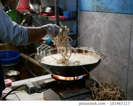 Making keripik usus ayam or chicken intestine crisphy at home. is a processed chicken intestine that is made into chips. It tastes savory and has a crunchy texture that can be used as a snack. Making keripik usus ayam or chicken intestine crisphy at home. is a processed chicken intestine that is made into chips. It tastes savory and has a crunchy texture that can be used as a snack. 101467117