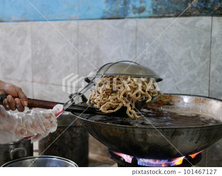 Making keripik usus ayam or chicken intestine crisphy at home. is a processed chicken intestine that is made into chips. It tastes savory and has a crunchy texture that can be used as a snack. 101467127