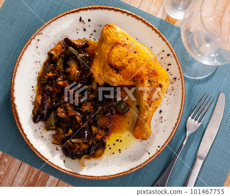 Delicious baked chicken thigh with stewed vegetables on plate Delicious baked chicken thigh with stewed vegetables on plate 101467755