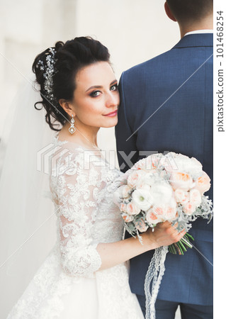 Portrait of stunning bride with long hair posing with great bouquet Portrait of stunning bride with long hair posing with great bouquet 101468254