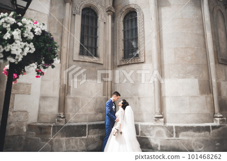 Perfect couple bride, groom posing and kissing in their wedding day Perfect couple bride, groom posing and kissing in their wedding day 101468262