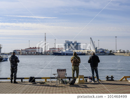 Fishermen at the seaport in winter Fishermen at the seaport in winter 101468499