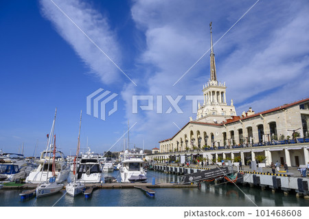 Yacht parking in front of the seaport building with a spire and a star in Sochi, Russia 101468608