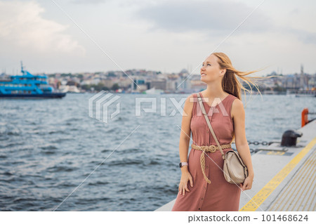Woman tourist enjoying Galataport area view, cruise port of Istanbul newly opening in 2021, located in the shores of the Galata, Karakoy in Istanbul 101468624