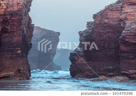 Rocky sea coast at sunrise. Beach Playa de Las Catedrales in Ribadeo, Spain, Europe Rocky sea coast at sunrise. Beach Playa de Las Catedrales in Ribadeo, Spain, Europe 101470396