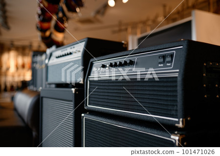 Audio sound amplifier equipment assortment at music shop showcase 101471026
