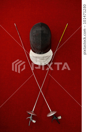 Fencing equipment concept, crossed swords and protective helmet with mask Fencing equipment concept, crossed swords and protective helmet with mask 101471280