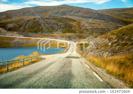 Driving a car on road in tundra. Nature of Norway. Polar circle. The way to Nordkapp 101471604