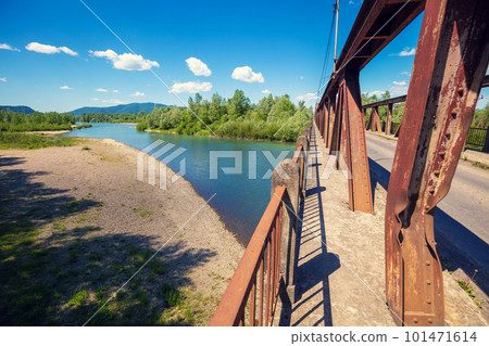 View of a mountain valley with the river from the bridge 101471614