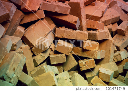 Clay handmade bricks. Abstract pile of bricks background 101471749