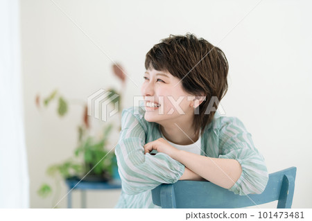 Young woman laughing happily at home Young woman laughing happily at home 101473481