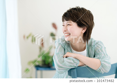Young woman laughing happily at home 101473482