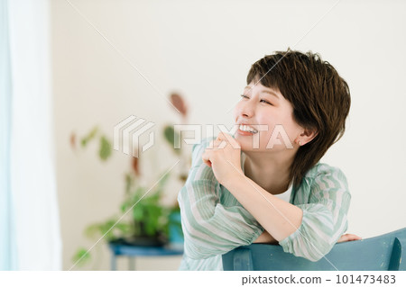 Young woman laughing happily at home 101473483