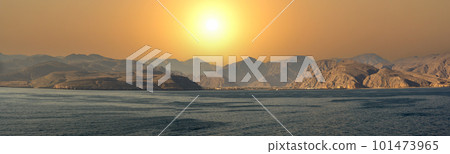 Sunset in Sinai Mountains, Oman. panorama of Sinai mountains on stunning sunset. colorful landscape. Wonderful solar Red Sea. Bible Landscape - Sinai And Red Sea 101473965