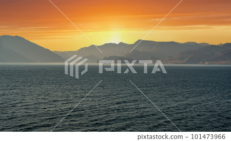 Sunset in Sinai Mountains, Oman. panorama of Sinai mountains on stunning sunset. colorful landscape. Wonderful solar Red Sea. Bible Landscape - Sinai And Red Sea 101473966