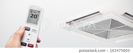 Air conditioner at home, hand with remote control 101475003