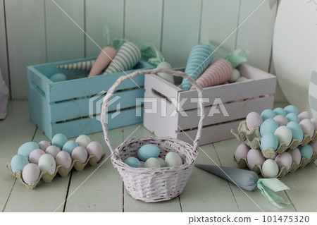 bucket with painted eggs for Easter basket background for the holiday 101475320