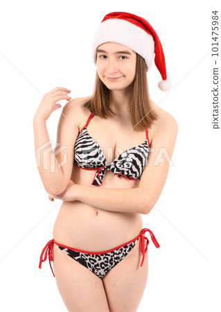 Young beautiful girl in a bathing suit isolated on a white background. 101475984