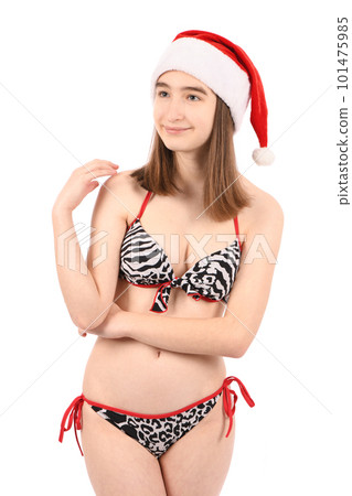Young beautiful girl in a bathing suit isolated on a white background. 101475985