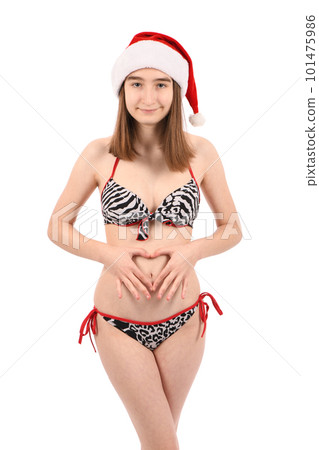 Young beautiful girl in a bathing suit isolated on a white background. 101475986