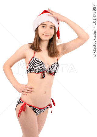 Young beautiful girl in a bathing suit isolated on a white background. Young beautiful girl in a bathing suit isolated on a white background. 101475987