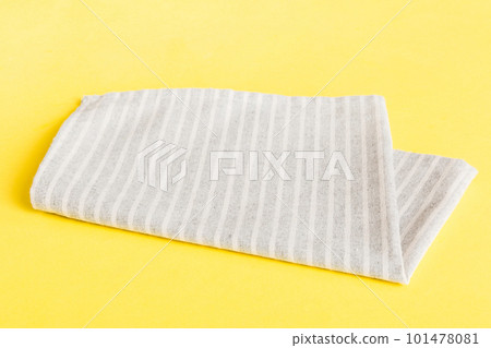 top view with gray kitchen napkin isolated on table background. Folded cloth for mockup with copy space, Flat lay. Minimal style 101478081
