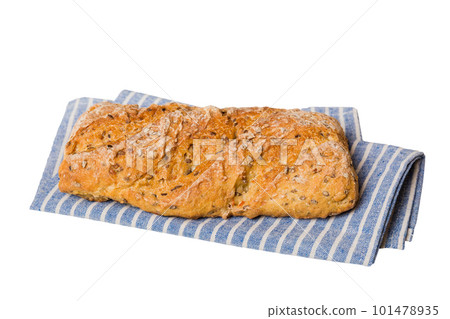 Freshly baked delicious french bread with napkin isolated on white background top view. Healthy white bread loaf Freshly baked delicious french bread with napkin isolated on white background top view. Healthy white bread loaf 101478935