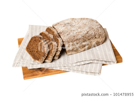 Assortment of freshly sliced baked bread with napkin isolated on white background. Healthy unleavened bread. French bread slice Assortment of freshly sliced baked bread with napkin isolated on white background. Healthy unleavened bread. French bread slice 101478955