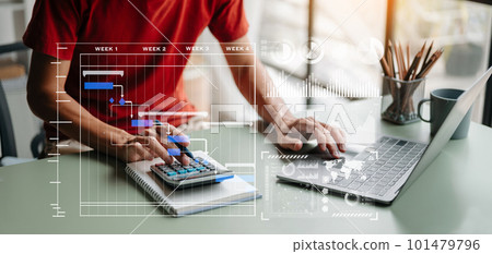 Businessman hand Project manager working and update tasks and Gantt chart scheduling virtual diagram.with smart phone, tablet and laptop in office.. Businessman hand Project manager working and update tasks and Gantt chart scheduling virtual diagram.with smart phone, tablet and laptop in office.. 101479796