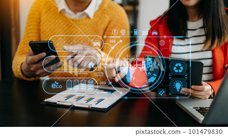 Business team working virtual modern smartphone to reduce CO2 emissions carbon footprint climate change to limit global warming.Sustainable development and green business concept. at office 101479830