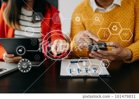 Business team working virtual modern smartphone to reduce CO2 emissions carbon footprint climate change to limit global warming.Sustainable development and green business concept. at office Business team working virtual modern smartphone to reduce CO2 emissions carbon footprint climate change to limit global warming.Sustainable development and green business concept. at office 101479831