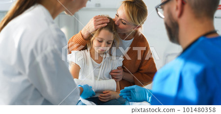 Little girl with her mother in surgery examination. 101480358