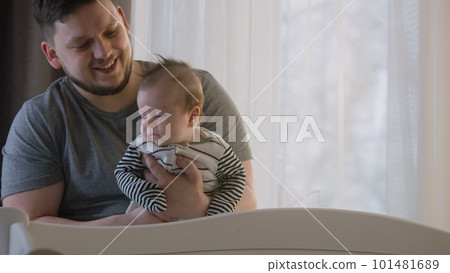 Loving father holds baby daughter or son in his arms Loving father holds baby daughter or son in his arms 101481689