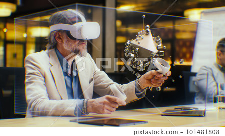 Male designer in VR headset creates abstract 3D shape Male designer in VR headset creates abstract 3D shape 101481808