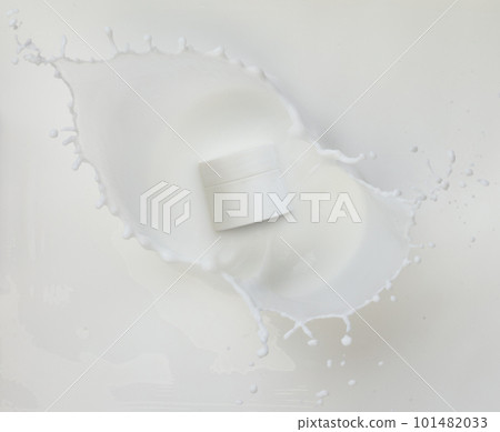 Cosmetic container white lotion droplet fly splashing. Milk lotion pour float to cosmetic bottle. Moisturizer lotion explosion spill. White background isolated high speed shutter freeze top view 101482033