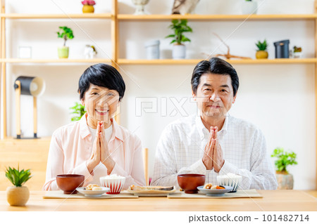 Senior couple eating in the dining room Senior couple eating in the dining room 101482714