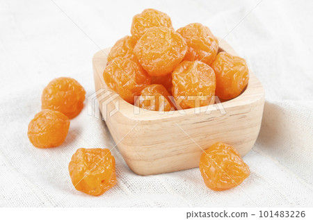 The reserved fruits or dried honey Chinese plum on wooden background 101483226