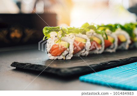 Close up of tasty japanese uramaki sushi with salmon 101484983