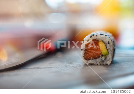 Close up of tasty japanese uramaki sushi with salmon 101485002