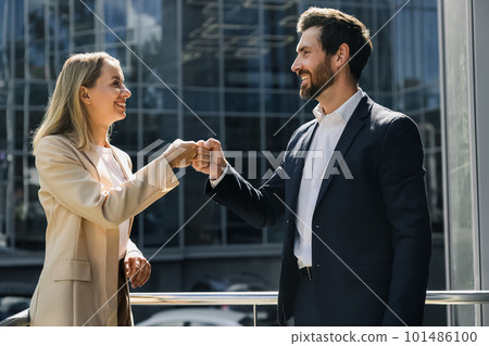 Business partners looking happy and contented Business partners looking happy and contented 101486100