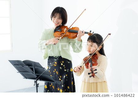 A child playing the violin A child playing the violin 101486422
